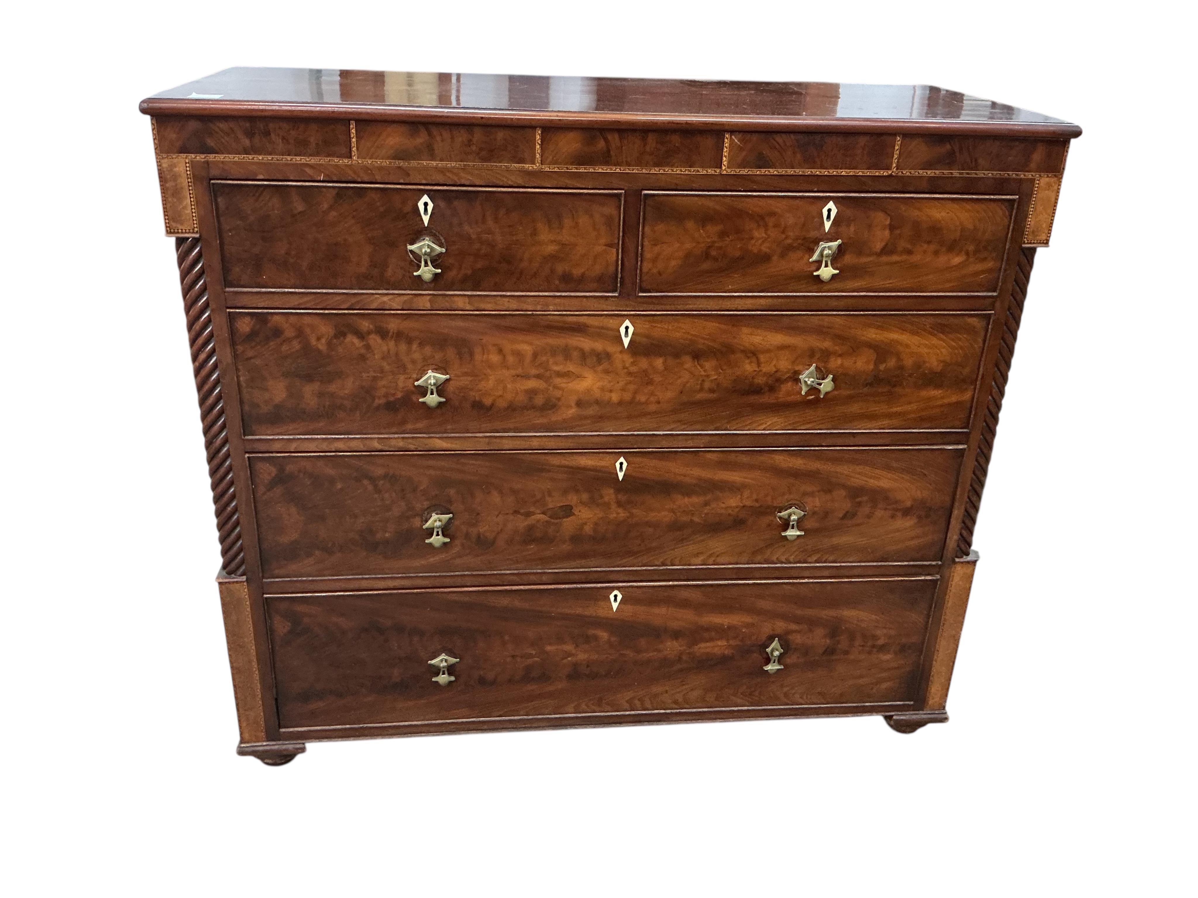 A George IV mahogany chest of drawers, canted corners and bone escutcheons, width 129cm, depth 53cm, height 113cm